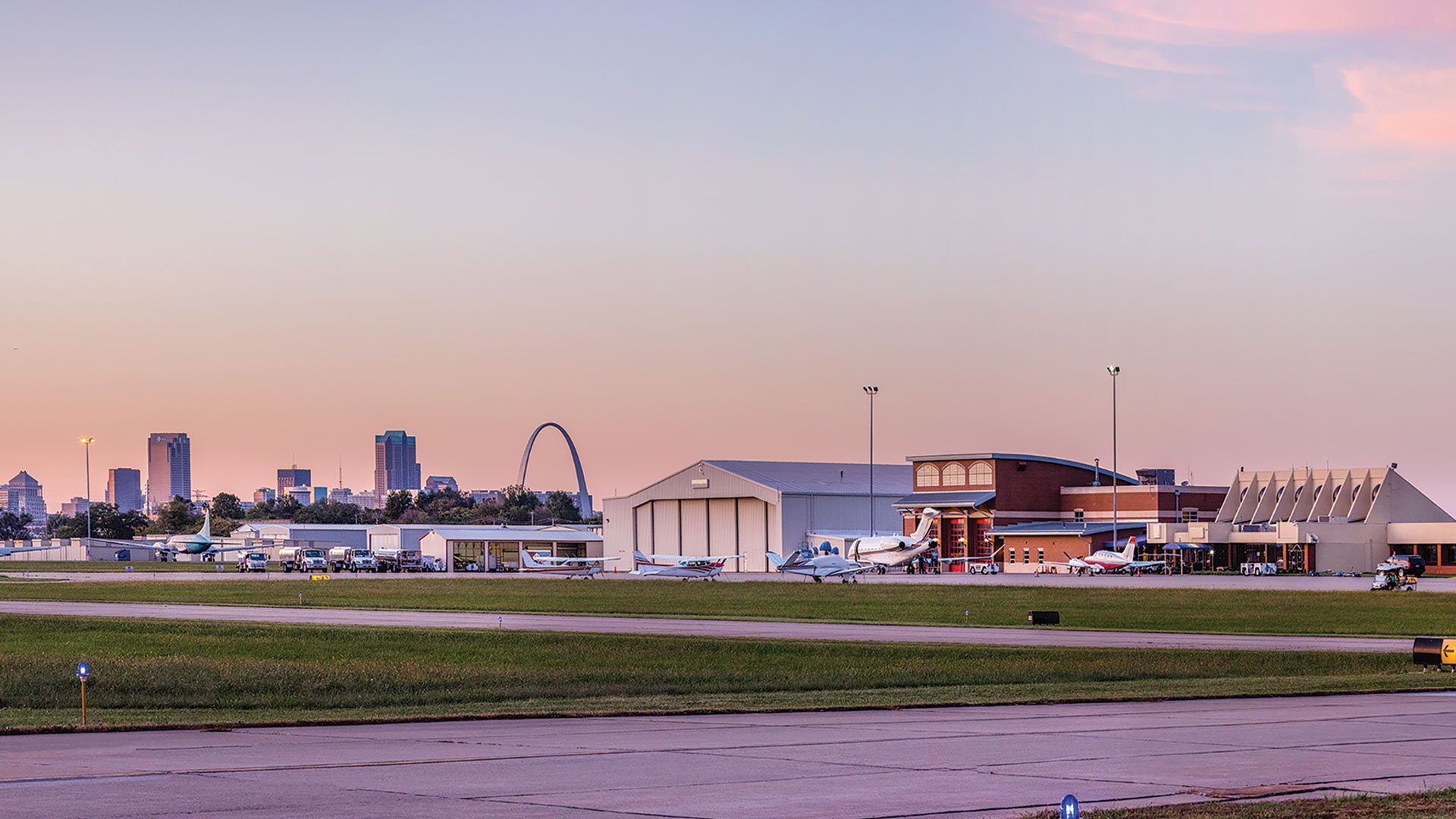 St. Louis Downtown Airport with the St. Louis skyline in the background.