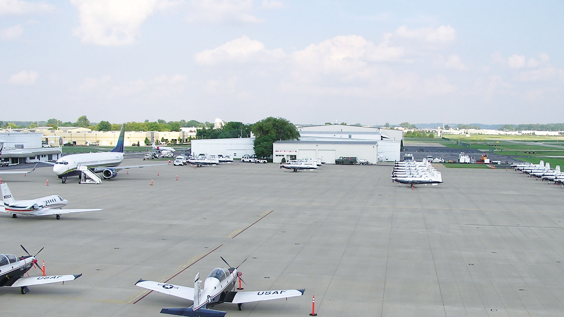 The Spirit of St. Louis Airport tarmac with various aircraft parked.